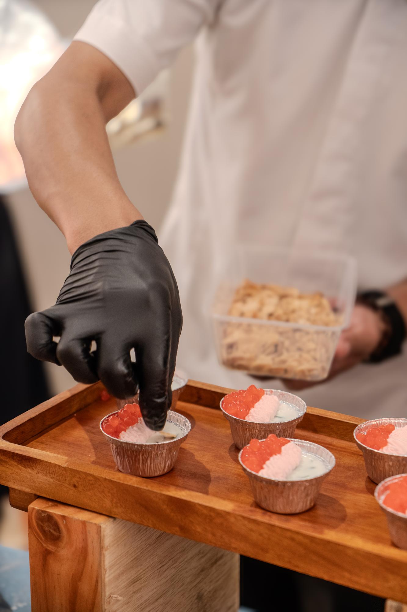 Chef arranging dessert in workshop